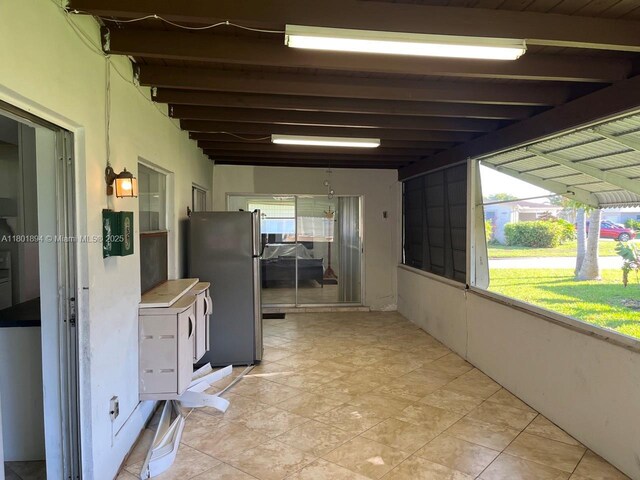 1130 NW 67th Ave, Margate, FL 33063 - hallway featuring plenty of natural light and light tile patterned floors