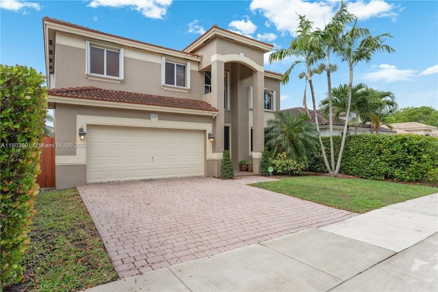 9248 SW 209th Ter, Cutler Bay, FL 33189 - view of front facade featuring stucco siding, decorative driveway, an attached garage, and a tiled roof