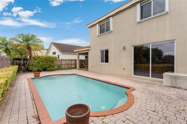 9248 SW 209th Ter, Cutler Bay, FL 33189 - view of swimming pool featuring a patio area and a fenced backyard