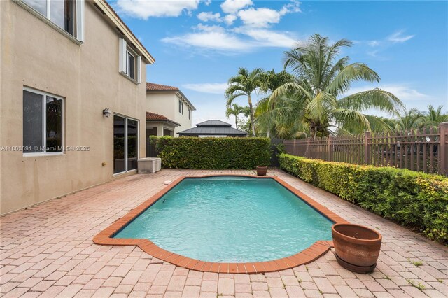 9248 SW 209th Ter, Cutler Bay, FL 33189 - view of pool featuring a patio area and a fenced backyard