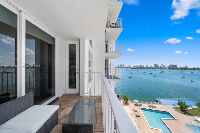 1228 W Ave Unit 704, Miami Beach, FL 33139 - balcony featuring a water view, a skyline view, and view of pool