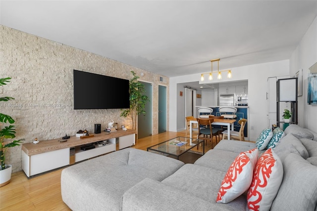 1228 W Ave Unit 704, Miami Beach, FL 33139 - living area with light wood-style flooring