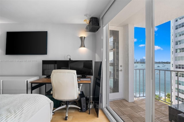 1228 W Ave Unit 704, Miami Beach, FL 33139 - bedroom featuring a desk, access to outside, and parquet flooring