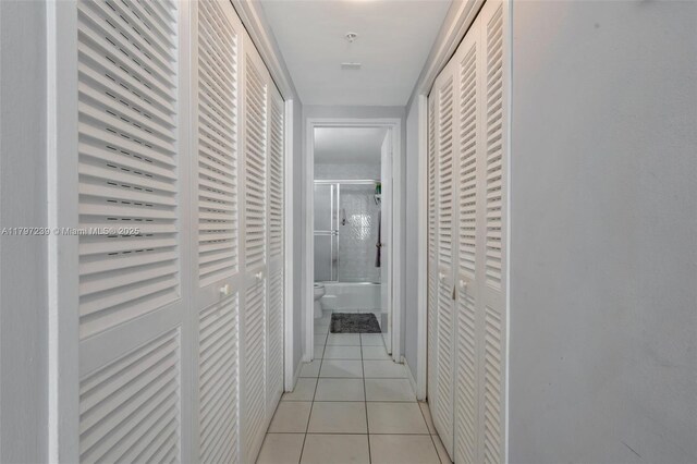 5601 Collins Ave Unit 615, Miami Beach, FL 33140 - hallway featuring light tile patterned floors