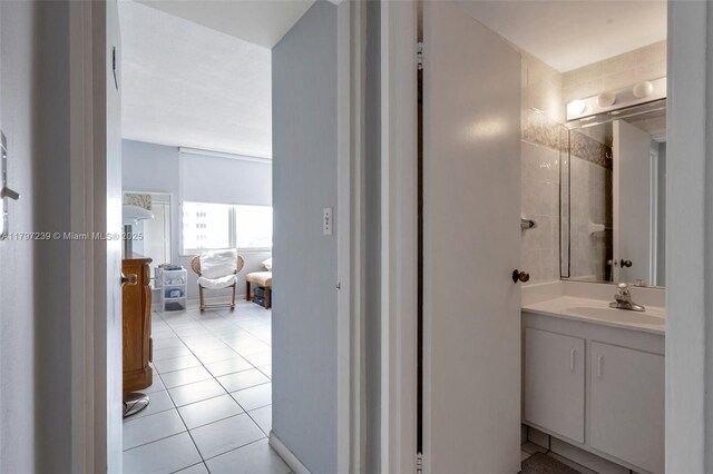 5601 Collins Ave Unit 615, Miami Beach, FL 33140 - bathroom with vanity and tile patterned floors