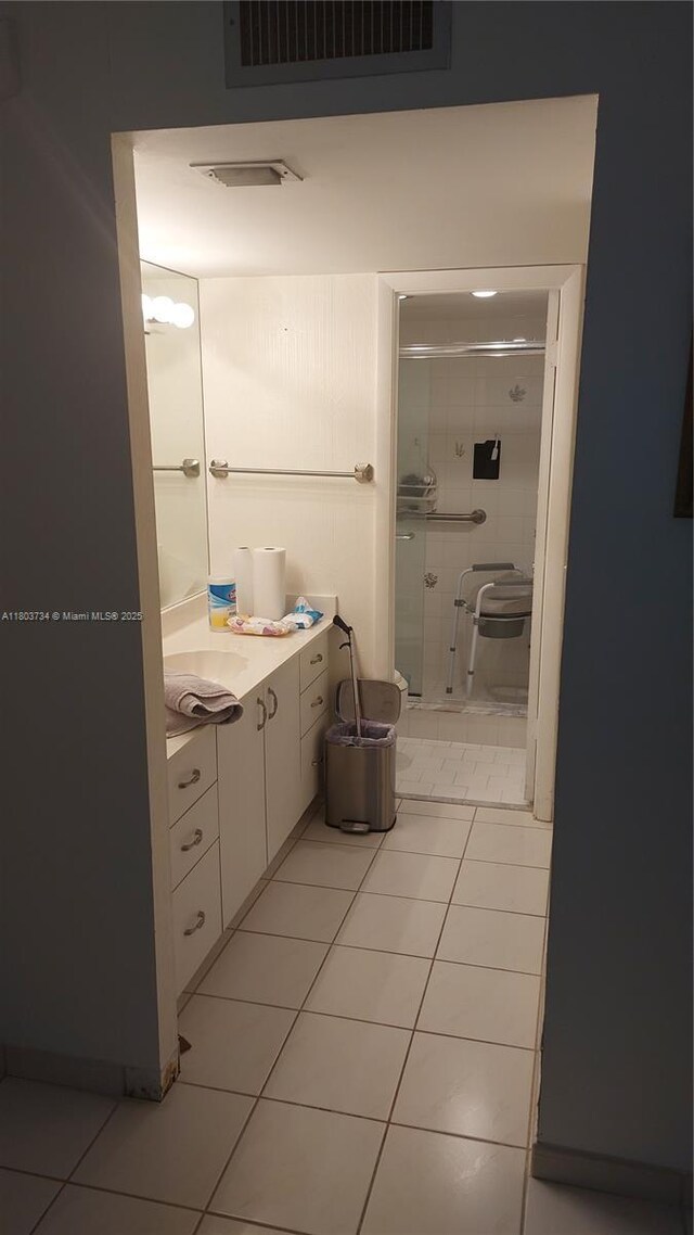 1400 Saint Charles Pl Unit L4, Pembroke Pines, FL 33026 - bathroom with a stall shower, tile patterned flooring, and vanity