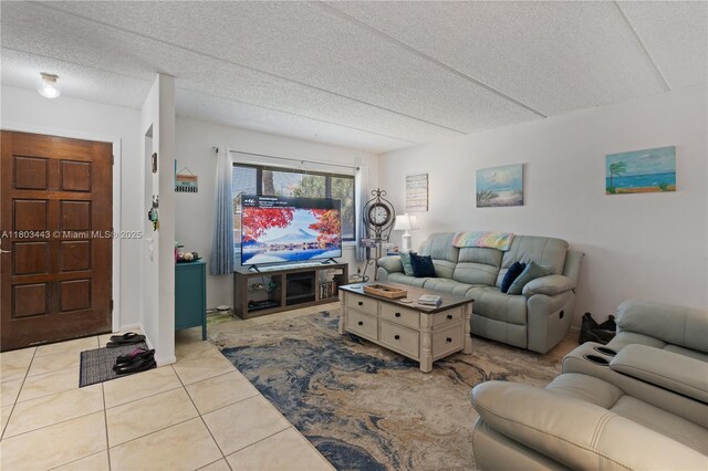 1145 N Shannon Unit 39, Indialantic, FL 32903 - living room featuring tile patterned flooring and a textured ceiling