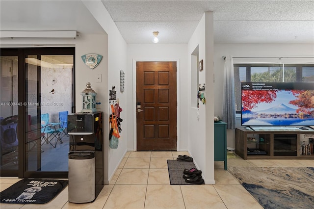 1145 N Shannon Unit 39, Indialantic, FL 32903 - tiled foyer with baseboards and a textured ceiling