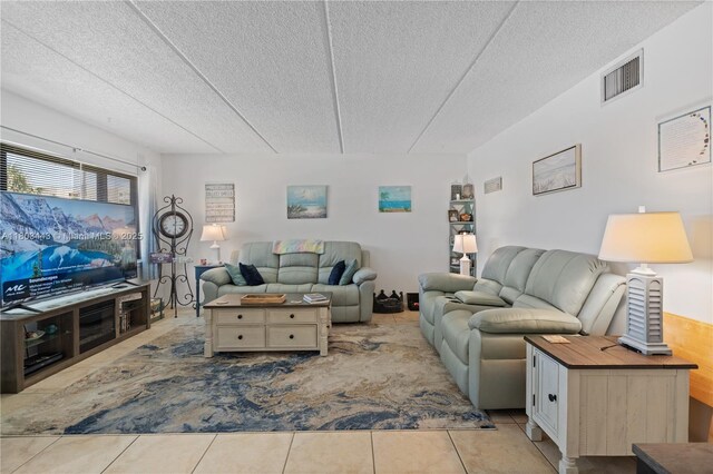 1145 N Shannon Unit 39, Indialantic, FL 32903 - living area with a textured ceiling and tile patterned floors