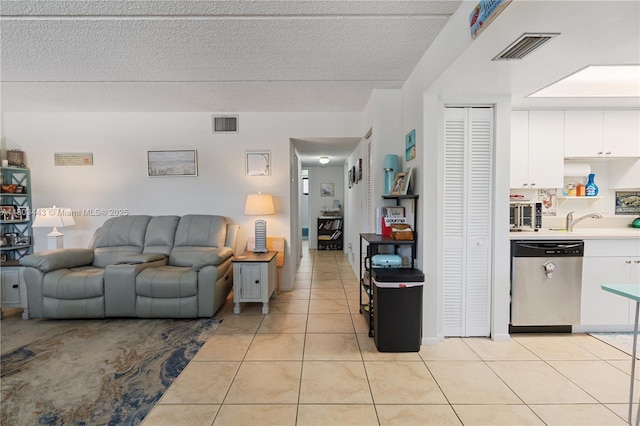 1145 N Shannon Unit 39, Indialantic, FL 32903 - living room featuring light tile patterned flooring and a textured ceiling