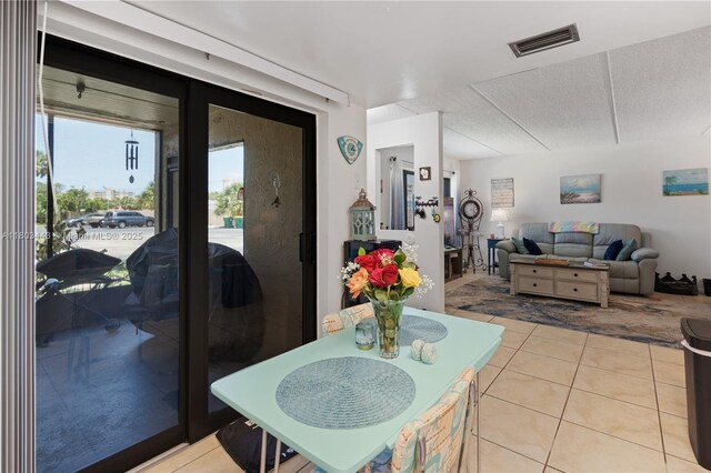 1145 N Shannon Unit 39, Indialantic, FL 32903 - dining space featuring light tile patterned floors