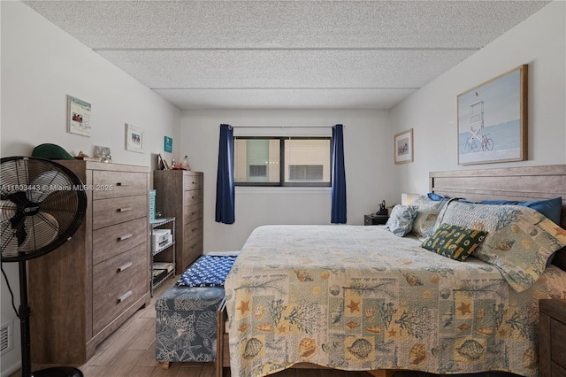 1145 N Shannon Unit 39, Indialantic, FL 32903 - bedroom featuring wood finished floors and a textured ceiling