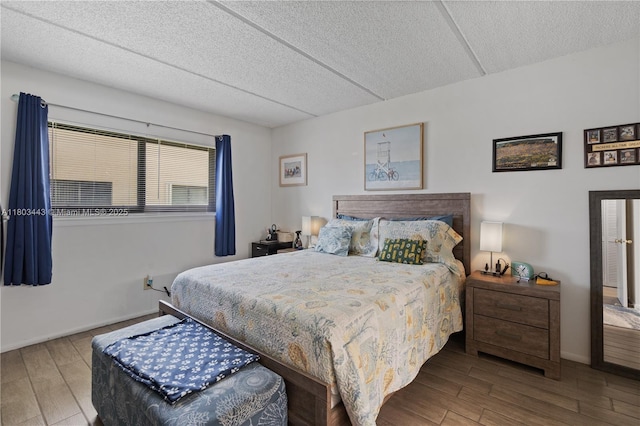 1145 N Shannon Unit 39, Indialantic, FL 32903 - bedroom with wood finished floors, a textured ceiling, and baseboards