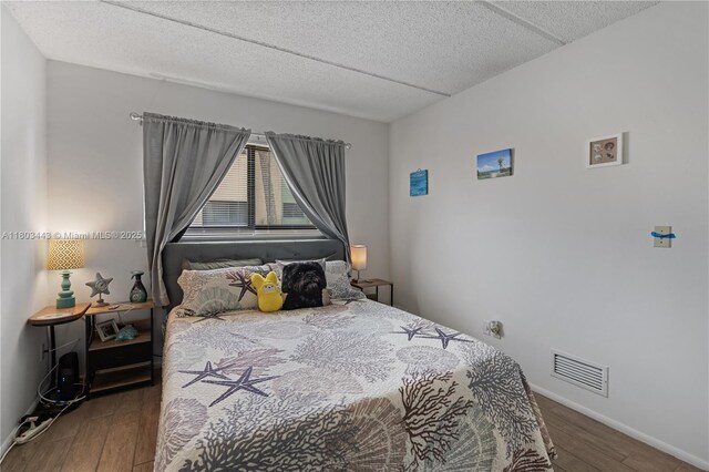 1145 N Shannon Unit 39, Indialantic, FL 32903 - bedroom with wood finished floors, a textured ceiling, and baseboards