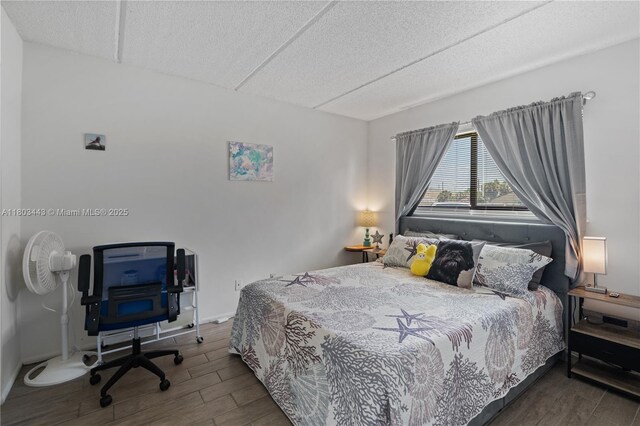1145 N Shannon Unit 39, Indialantic, FL 32903 - bedroom featuring wood finished floors and a textured ceiling