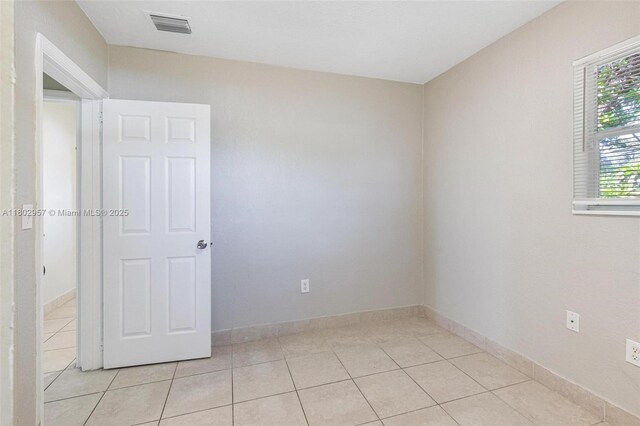 20740 NE 13th Ct, Miami, FL 33179 - unfurnished room featuring light tile patterned flooring and baseboards