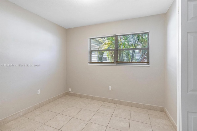 20740 NE 13th Ct, Miami, FL 33179 - unfurnished room with light tile patterned floors and baseboards