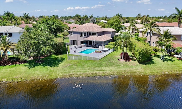 5081 NW 120th Ave, Coral Springs, FL 33076 - rear view of property featuring a residential view, an outdoor pool, a water view, and a fenced backyard