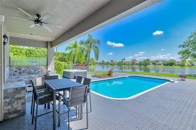 5081 NW 120th Ave, Coral Springs, FL 33076 - view of swimming pool with a patio, a water view, a fenced backyard, a ceiling fan, and outdoor dining area