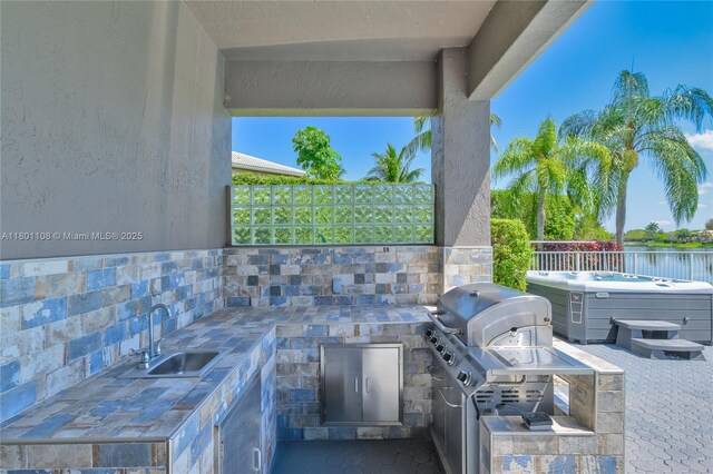 5081 NW 120th Ave, Coral Springs, FL 33076 - view of patio with a hot tub and an outdoor kitchen