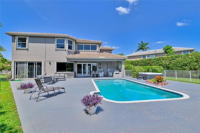 5081 NW 120th Ave, Coral Springs, FL 33076 - view of pool featuring a patio area, a fenced backyard, a hot tub, and french doors