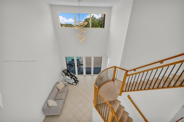5081 NW 120th Ave, Coral Springs, FL 33076 - stairs with a high ceiling and tile patterned floors
