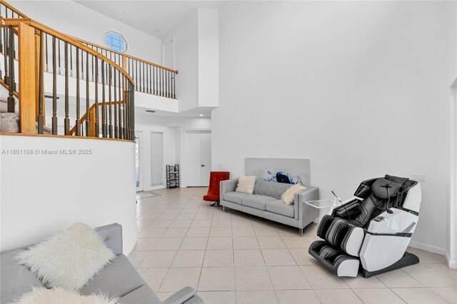 5081 NW 120th Ave, Coral Springs, FL 33076 - living room with light tile patterned floors, stairway, and a towering ceiling