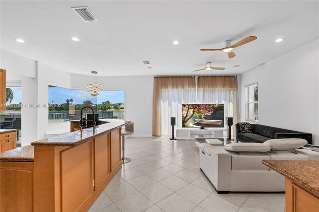 5081 NW 120th Ave, Coral Springs, FL 33076 - living area featuring recessed lighting, plenty of natural light, light tile patterned floors, and a ceiling fan