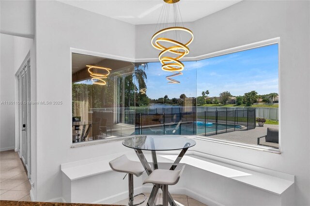 5081 NW 120th Ave, Coral Springs, FL 33076 - tiled dining space featuring a chandelier