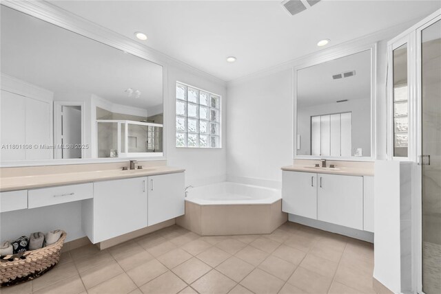 5081 NW 120th Ave, Coral Springs, FL 33076 - full bathroom featuring ornamental molding, a shower stall, two vanities, a garden tub, and tile patterned flooring