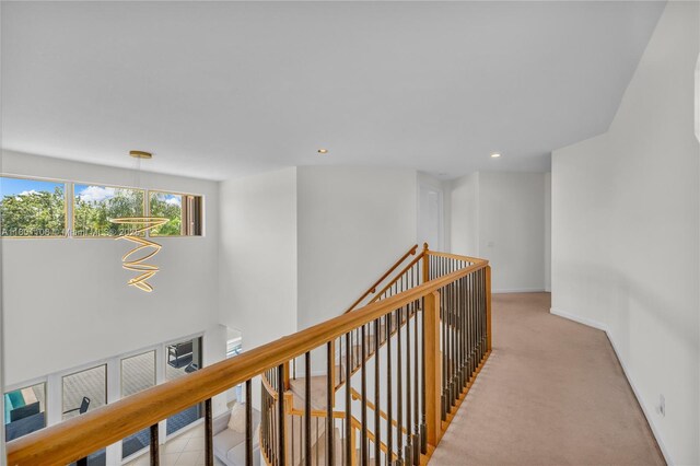 5081 NW 120th Ave, Coral Springs, FL 33076 - hallway with an upstairs landing, a chandelier, carpet, and recessed lighting