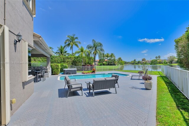 5081 NW 120th Ave, Coral Springs, FL 33076 - view of pool with a fenced backyard, a water view, and a patio