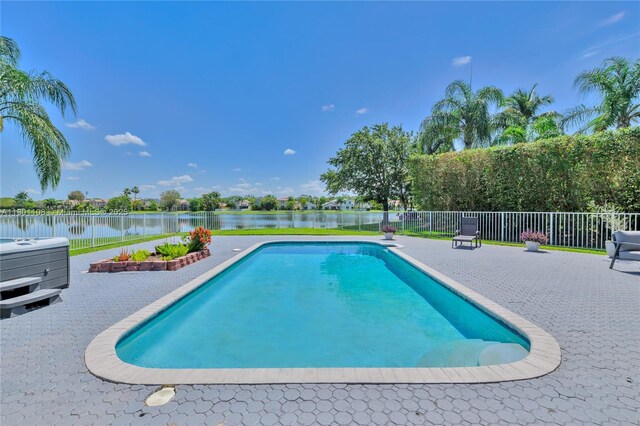 5081 NW 120th Ave, Coral Springs, FL 33076 - view of pool featuring a water view and a patio area