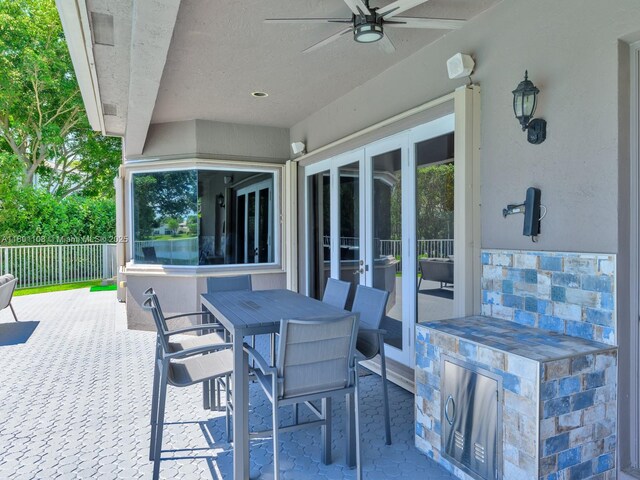 5081 NW 120th Ave, Coral Springs, FL 33076 - view of patio with ceiling fan and outdoor dining area