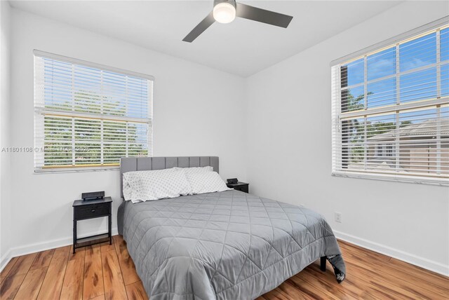 5081 NW 120th Ave, Coral Springs, FL 33076 - bedroom featuring wood finished floors and a ceiling fan