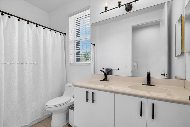 5081 NW 120th Ave, Coral Springs, FL 33076 - full bathroom with double vanity, plenty of natural light, tile patterned floors, and curtained shower