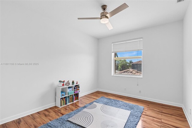 5081 NW 120th Ave, Coral Springs, FL 33076 - bedroom with wood finished floors and a ceiling fan