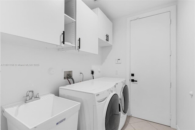5081 NW 120th Ave, Coral Springs, FL 33076 - laundry room with cabinet space, light tile patterned flooring, and independent washer and dryer