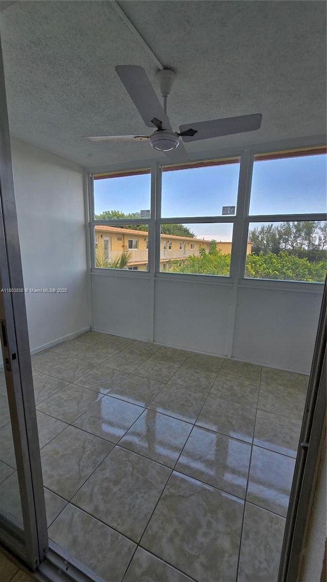 unfurnished sunroom with plenty of natural light
