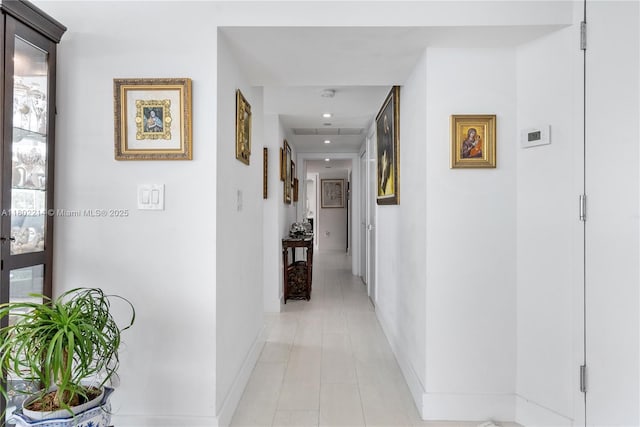 2127 Brickell Ave Unit 502, Miami, FL 33129 - hallway featuring baseboards, light tile patterned flooring, and recessed lighting