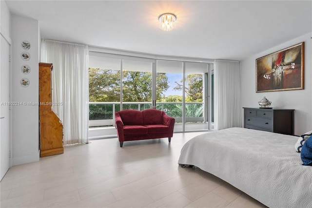 2127 Brickell Ave Unit 502, Miami, FL 33129 - bedroom featuring a wall of windows and access to outside