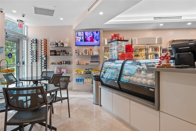 2127 Brickell Ave Unit 502, Miami, FL 33129 - bar with recessed lighting and light tile patterned floors
