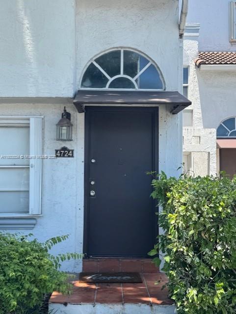 4724 NW 97th Ct Unit 87, Doral, FL 33178 - view of exterior entry with stucco siding