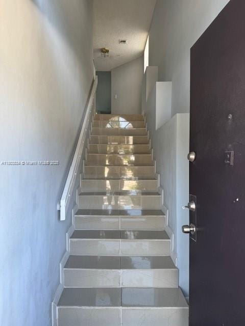 4724 NW 97th Ct Unit 87, Doral, FL 33178 - staircase with a towering ceiling