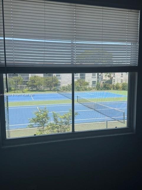 4724 NW 97th Ct Unit 87, Doral, FL 33178 - view of tennis court featuring fence