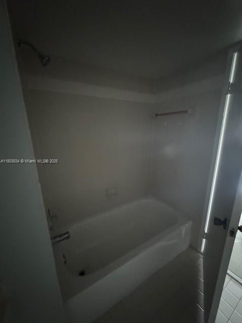 4724 NW 97th Ct Unit 87, Doral, FL 33178 - bathroom with washtub / shower combination and tile patterned floors