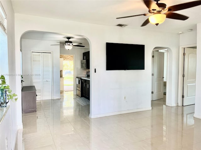 3135 SW 64th Ave, Miami, FL 33155 - unfurnished living room with arched walkways and a ceiling fan