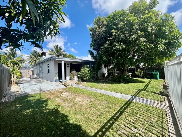 3135 SW 64th Ave, Miami, FL 33155 - fenced backyard with a patio area