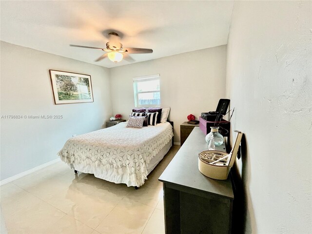 3135 SW 64th Ave, Miami, FL 33155 - bedroom featuring baseboards, light tile patterned flooring, and ceiling fan