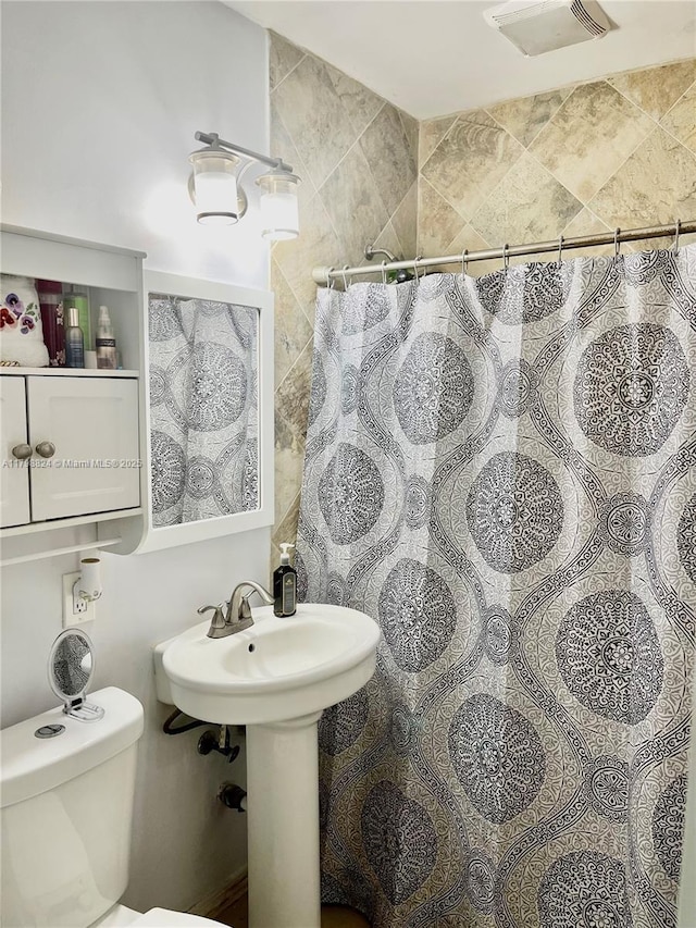 3135 SW 64th Ave, Miami, FL 33155 - bathroom with toilet and a shower with shower curtain